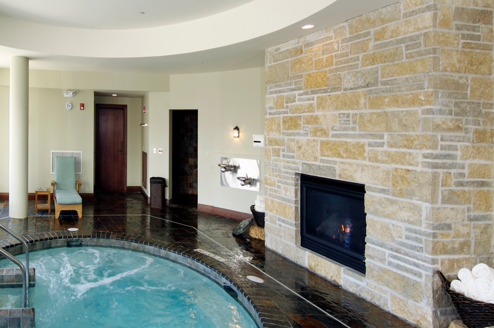 Design ideas for a large traditional indoor round pool in Other with a hot tub and tile.
