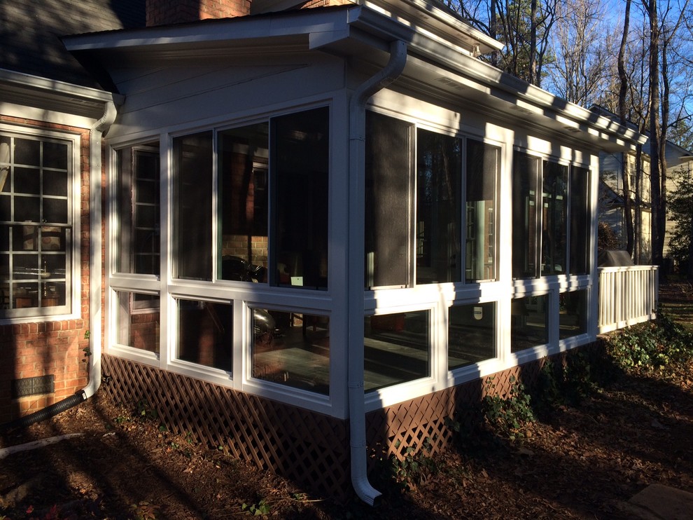 Photo of a traditional sunroom in Charlotte with ceramic floors.