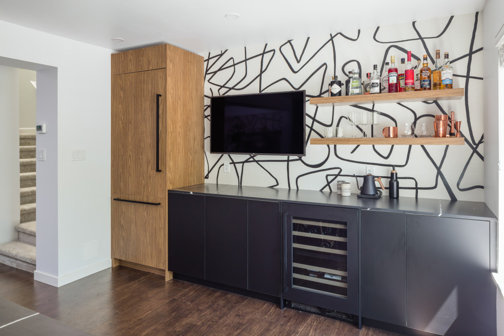 Photo of a mid-sized contemporary single-wall home bar in Vancouver with flat-panel cabinets, black cabinets, black splashback, timber splashback, dark hardwood floors, black floor, black benchtop and wood benchtops.