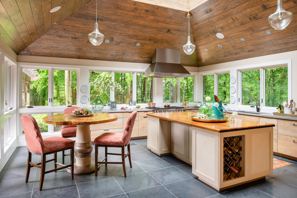 Country l-shaped eat-in kitchen in Philadelphia with an undermount sink, flat-panel cabinets, light wood cabinets, with island, grey floor and grey benchtop.