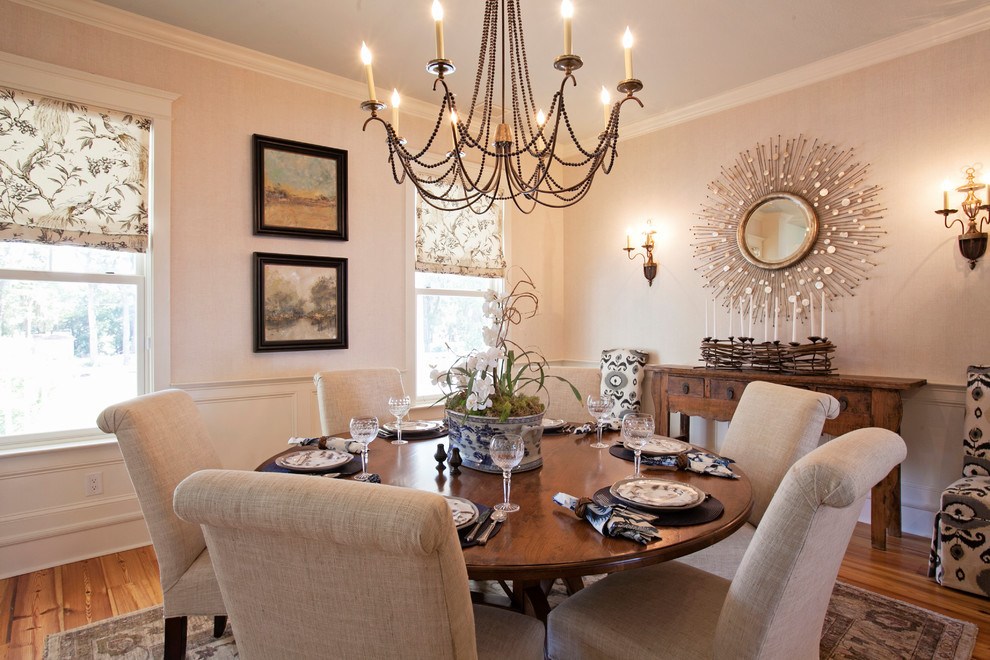 Photo of a large traditional separate dining room in Atlanta with beige walls, dark hardwood floors and no fireplace.