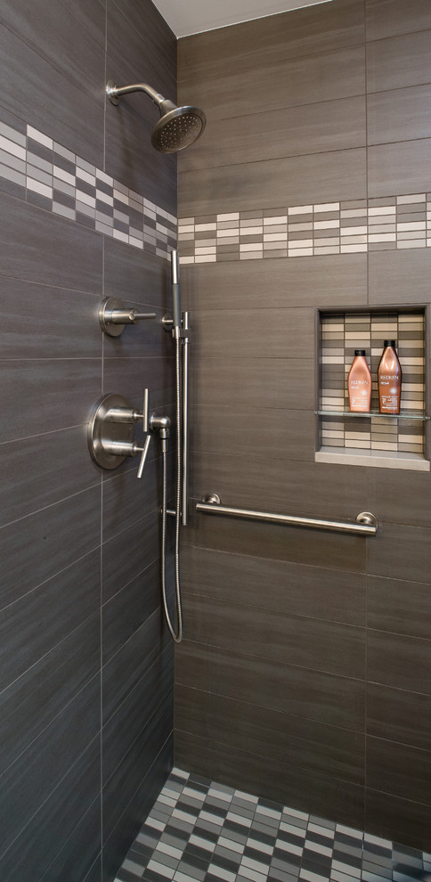 Design ideas for a small contemporary 3/4 bathroom in Other with recessed-panel cabinets, dark wood cabinets, an alcove shower, a two-piece toilet, gray tile, ceramic tile, grey walls, ceramic floors, an undermount sink and engineered quartz benchtops.