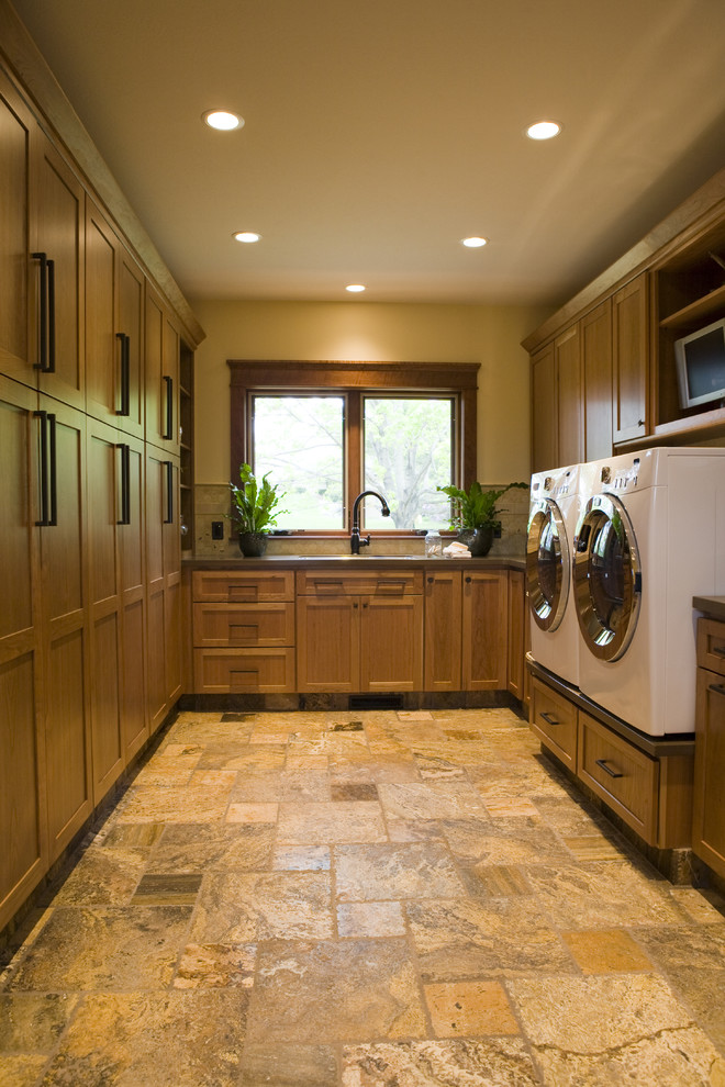 Inspiration for an arts and crafts u-shaped laundry room in Other with a side-by-side washer and dryer.