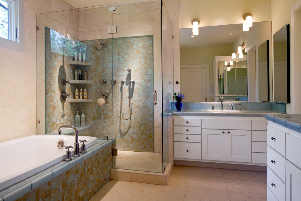 Photo of a contemporary bathroom in Austin with mosaic tile and tile benchtops.