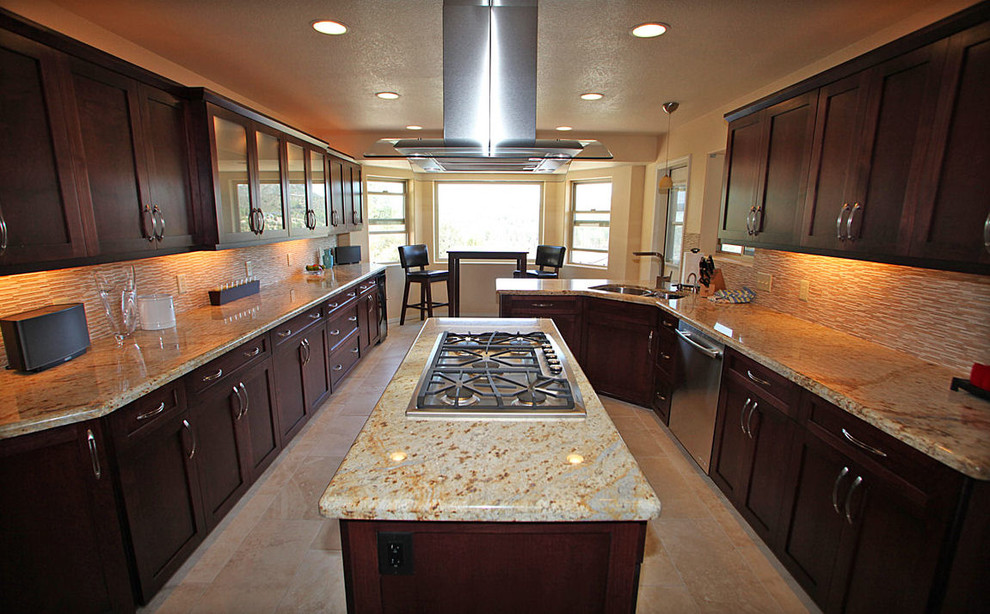 Large transitional l-shaped eat-in kitchen photo in Phoenix with shaker cabinets, dark wood cabinets, granite countertops, beige backsplash, glass tile backsplash, stainless steel appliances, an island and a double-bowl sink