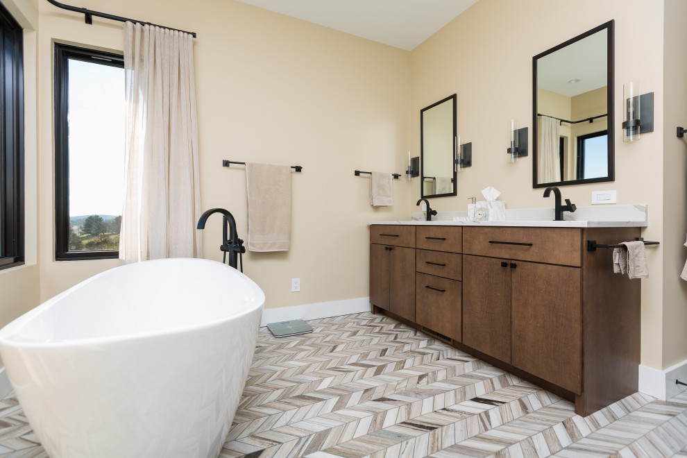 Large midcentury master bathroom in DC Metro with flat-panel cabinets, brown cabinets, a freestanding tub, multi-coloured tile, yellow walls, light hardwood floors, an undermount sink, engineered quartz benchtops, brown floor, white benchtops and a double vanity.