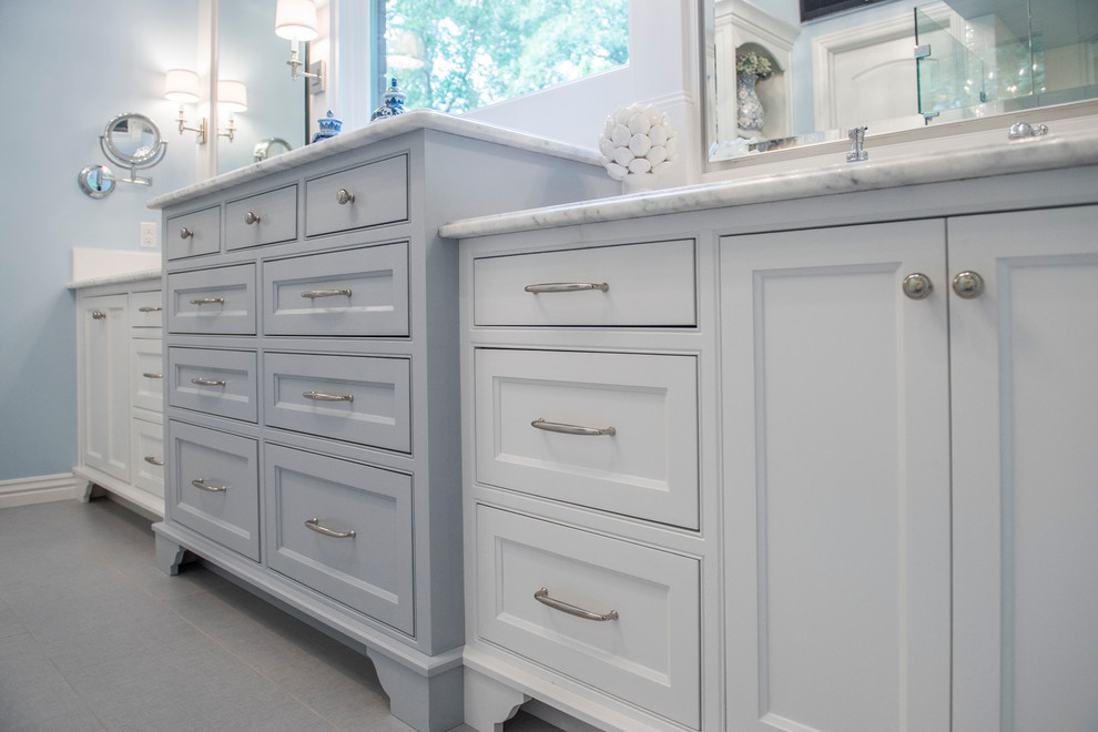 Mid-sized transitional master gray tile and porcelain tile porcelain tile corner shower photo with beaded inset cabinets, white cabinets, quartz countertops, blue walls and an undermount sink