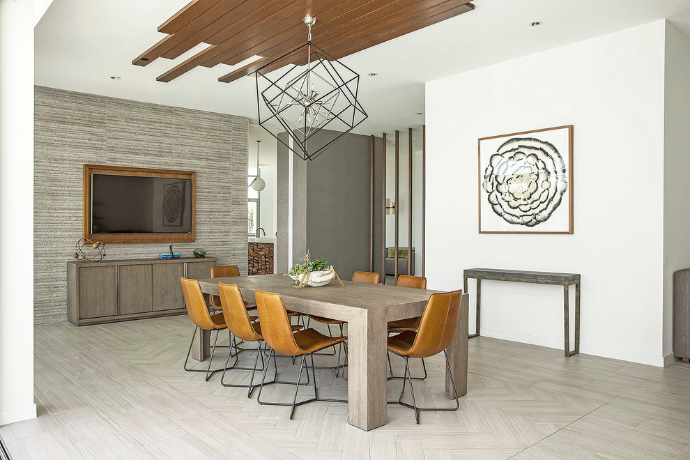 Photo of a contemporary dining room in New York with white walls and light hardwood floors.