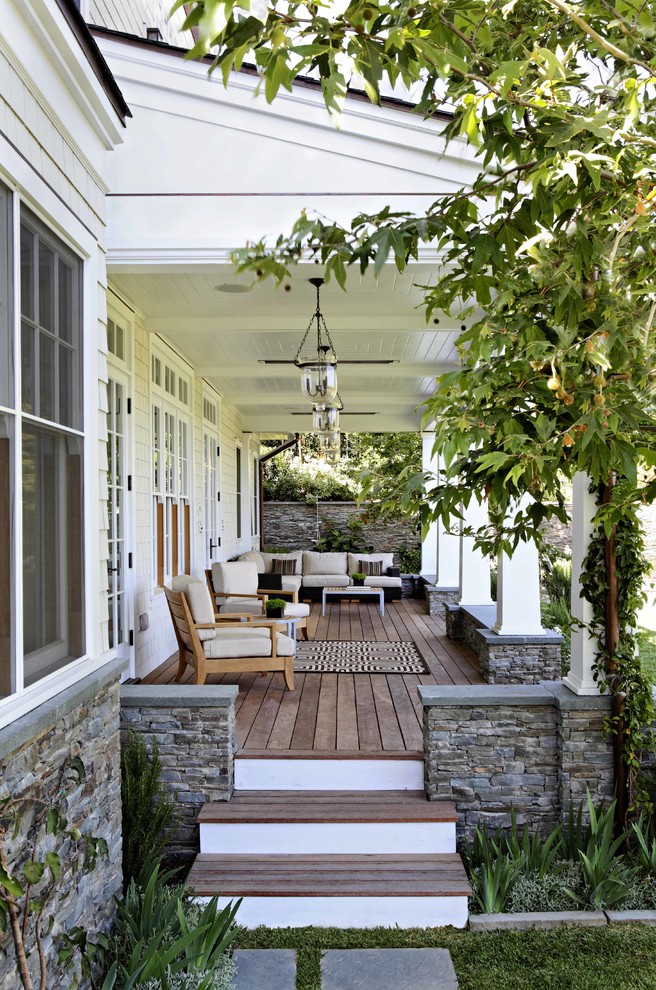 This is an example of a traditional verandah in Los Angeles with decking and a roof extension.