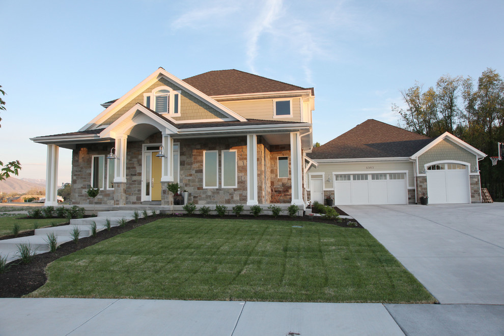 This is an example of a mid-sized arts and crafts three-storey green exterior in Salt Lake City with mixed siding.