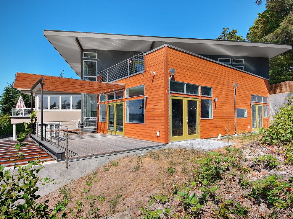 This is an example of a contemporary exterior in Seattle with wood siding.