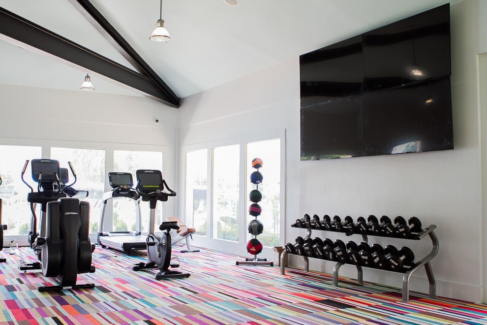 This is an example of a mid-sized contemporary multipurpose gym in New York with white walls and carpet.