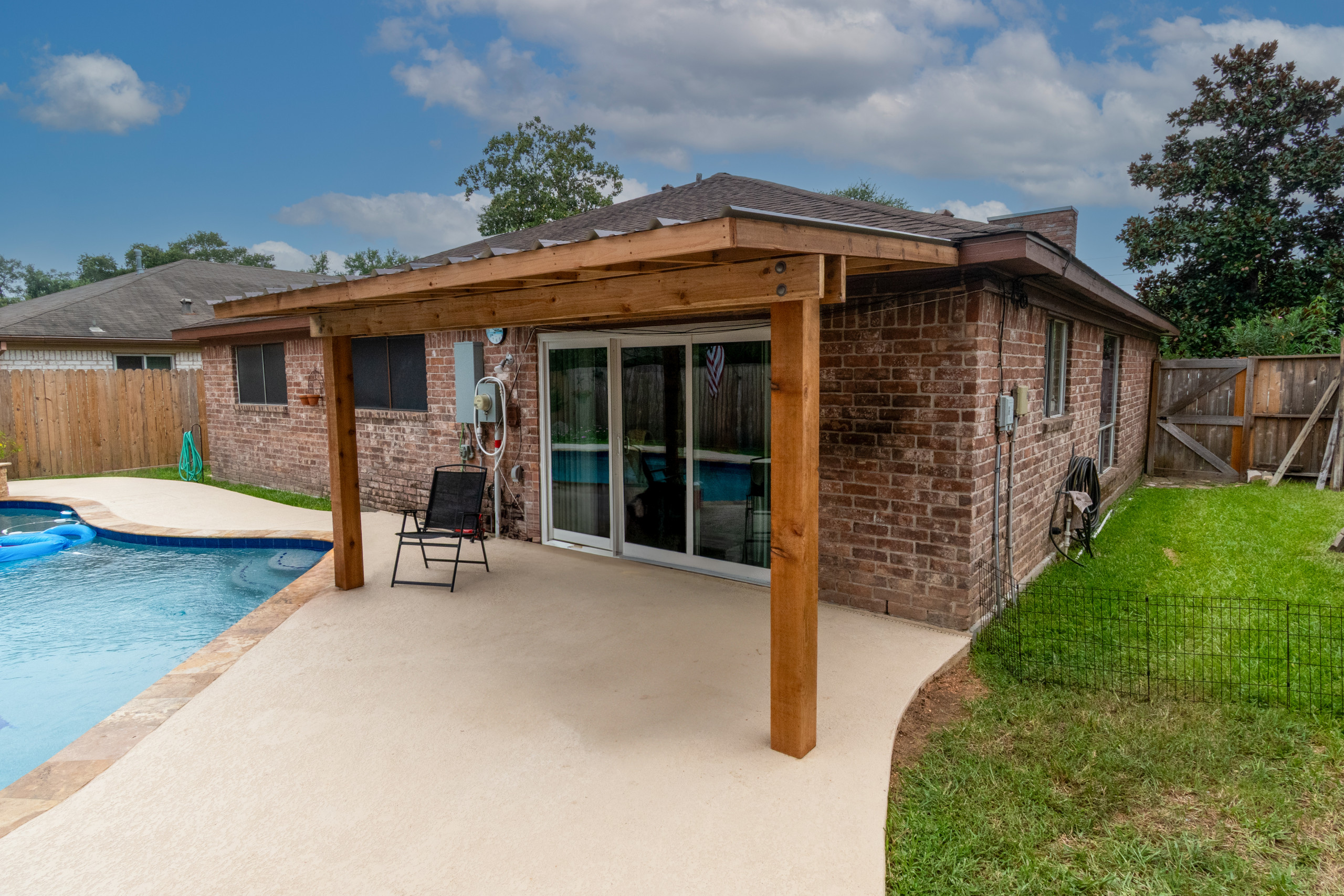 Custom Patio Cover Upgrade – Sealed Cedar & R-Panel Roofin