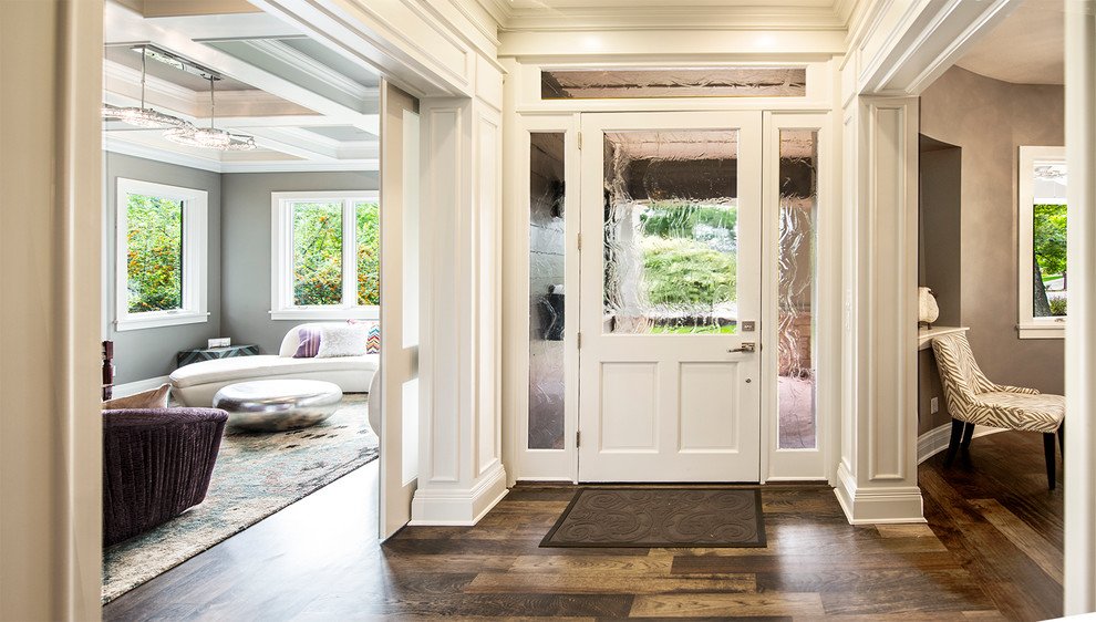 This is an example of a contemporary entryway in Austin with a glass front door.