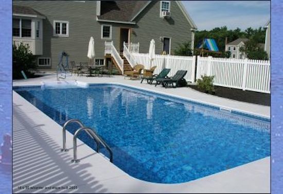 Photo of a mid-sized backyard rectangular pool in Portland Maine with concrete slab.
