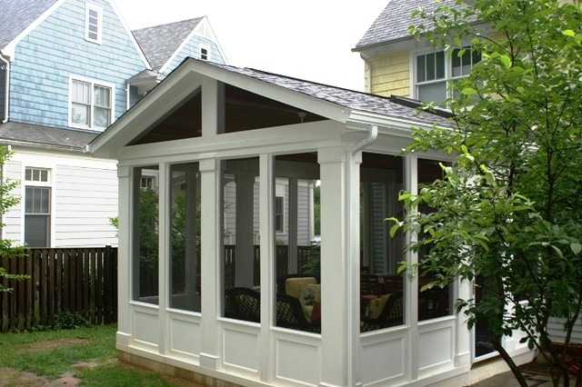 Photo of a mid-sized traditional sunroom in Other with no fireplace, medium hardwood floors, a standard ceiling and white floor.