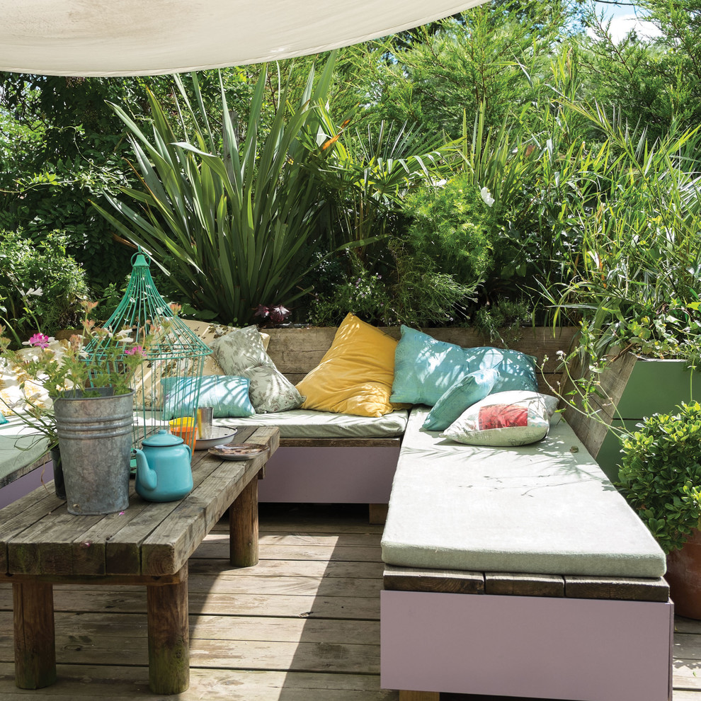 Tropical deck in Dorset with an awning.