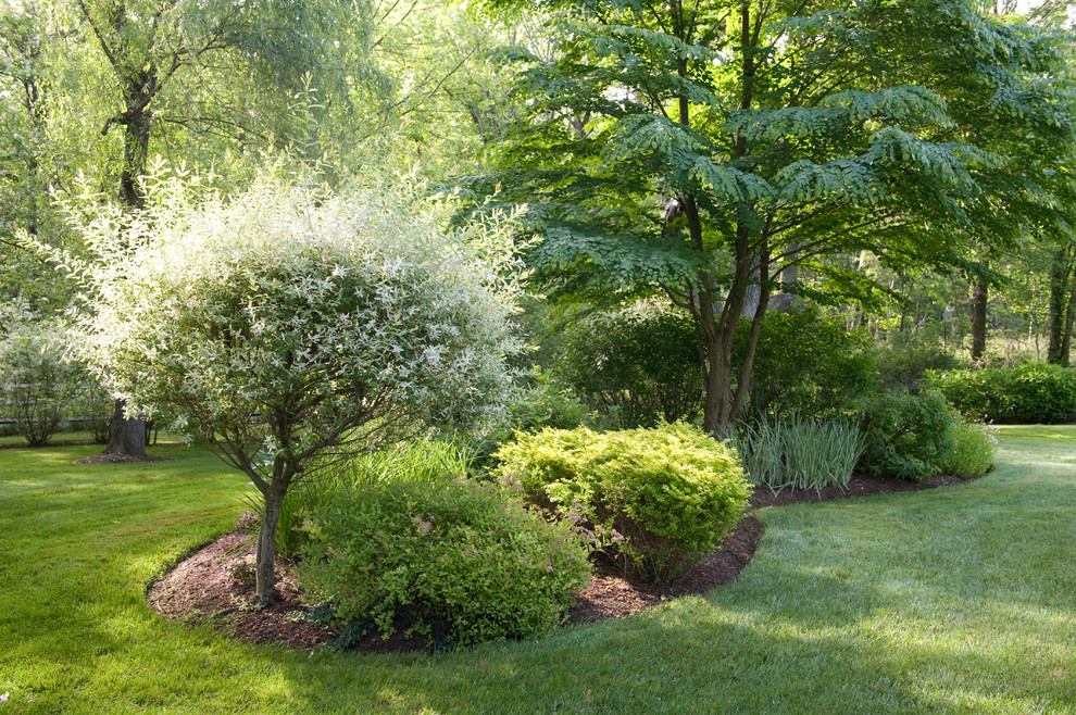 Inspiration for a large country backyard shaded formal garden in Baltimore with a garden path.