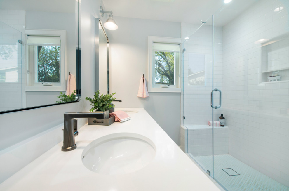 Example of a mid-sized transitional kids' white tile and ceramic tile porcelain tile, blue floor and double-sink alcove shower design in San Francisco with flat-panel cabinets, gray cabinets, a one-piece toilet, gray walls, an undermount sink, quartz countertops, a hinged shower door, white countertops and a freestanding vanity