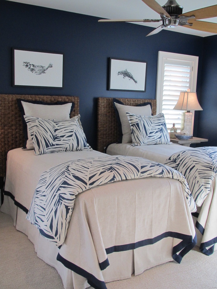 This is an example of a mid-sized beach style guest bedroom in Baltimore with blue walls, carpet, no fireplace and beige floor.
