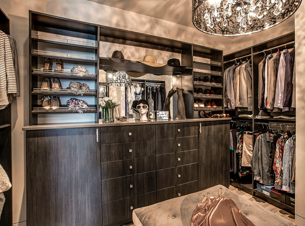 Design ideas for a large contemporary gender-neutral walk-in wardrobe in Vancouver with flat-panel cabinets, dark wood cabinets and ceramic floors.