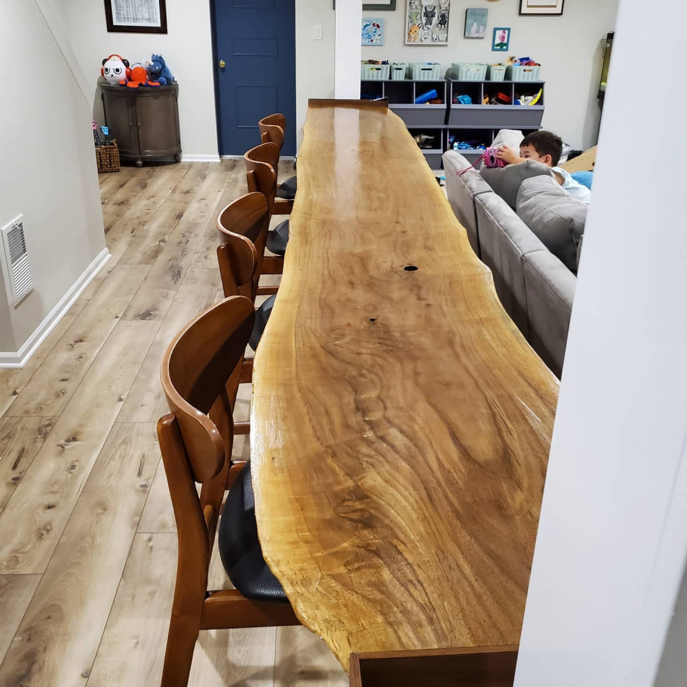 Inspiration for a rustic basement remodel in Chicago with a bar
