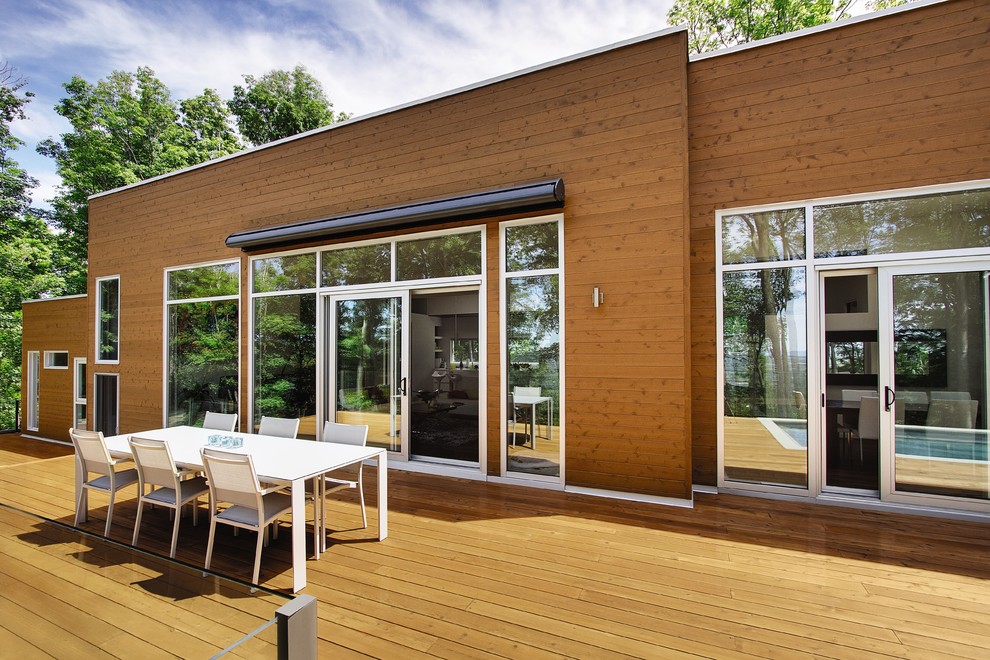 Photo of a large contemporary backyard deck in Other with no cover.