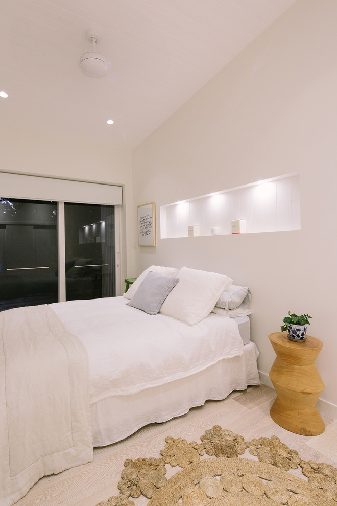 Inspiration for a beach style bedroom in Sydney.