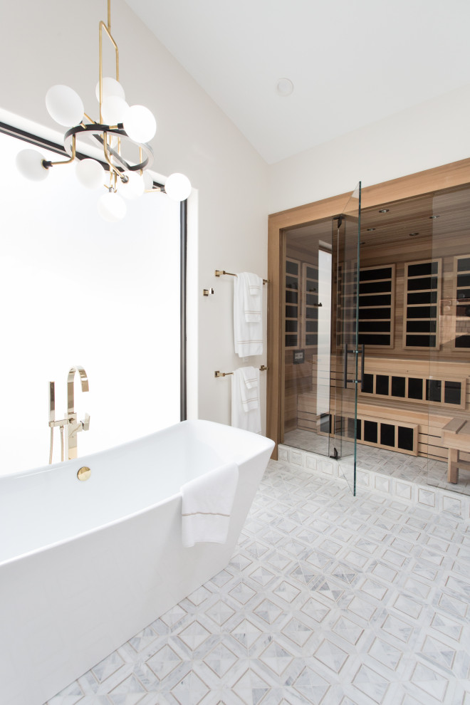 This is an example of an expansive transitional master bathroom in Santa Barbara with shaker cabinets, dark wood cabinets, a freestanding tub, an alcove shower, a one-piece toilet, white tile, marble, white walls, mosaic tile floors, an undermount sink, marble benchtops, multi-coloured floor, a hinged shower door and white benchtops.