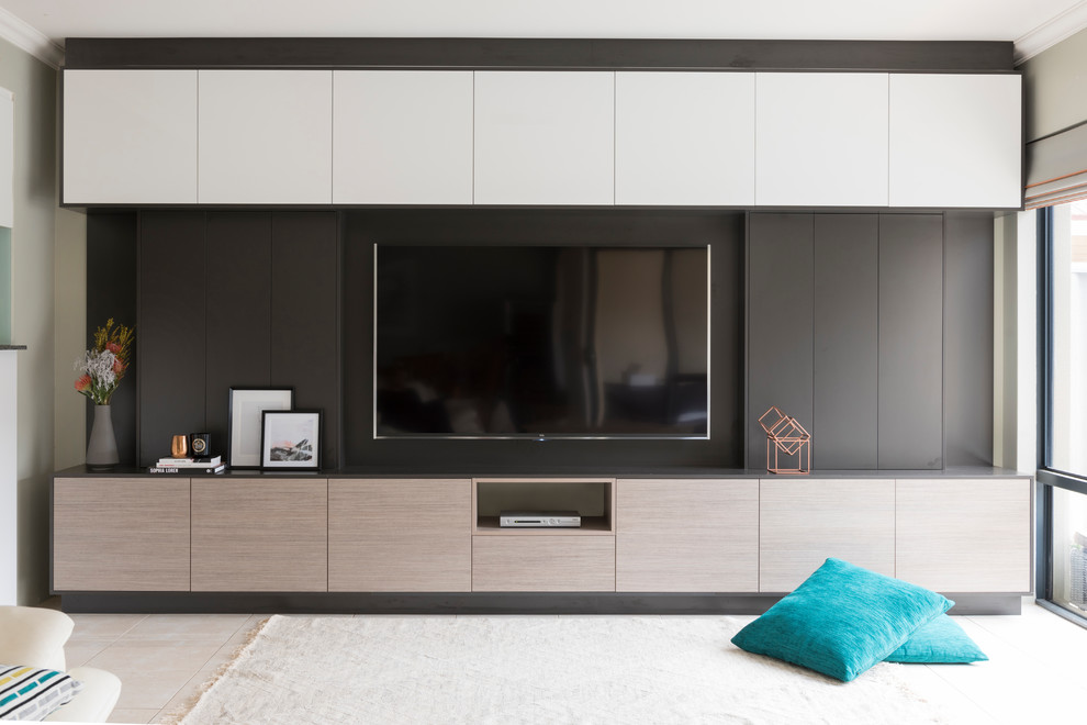 Inspiration for a large modern enclosed home theatre in Perth with black walls, a wall-mounted tv and beige floor.