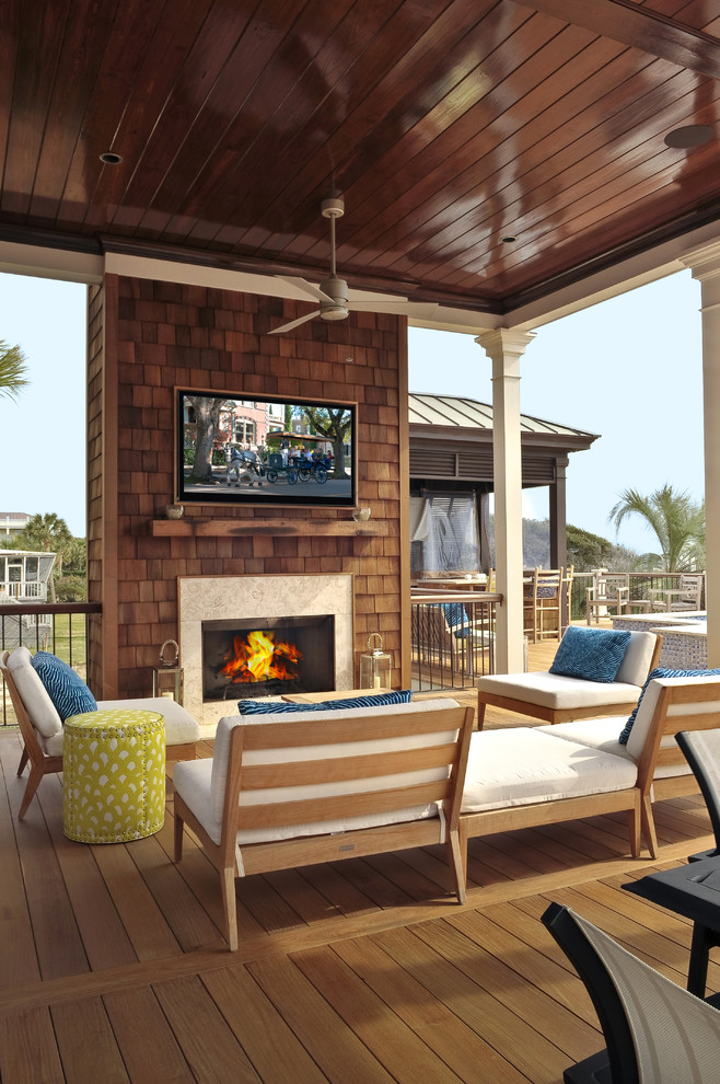Beach style deck in Charleston with a fire feature.
