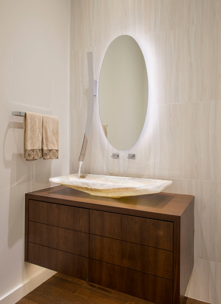 Design ideas for a contemporary powder room in Dallas with flat-panel cabinets, medium wood cabinets, beige tile, white walls, medium hardwood floors, a vessel sink, wood benchtops, brown floor and brown benchtops.
