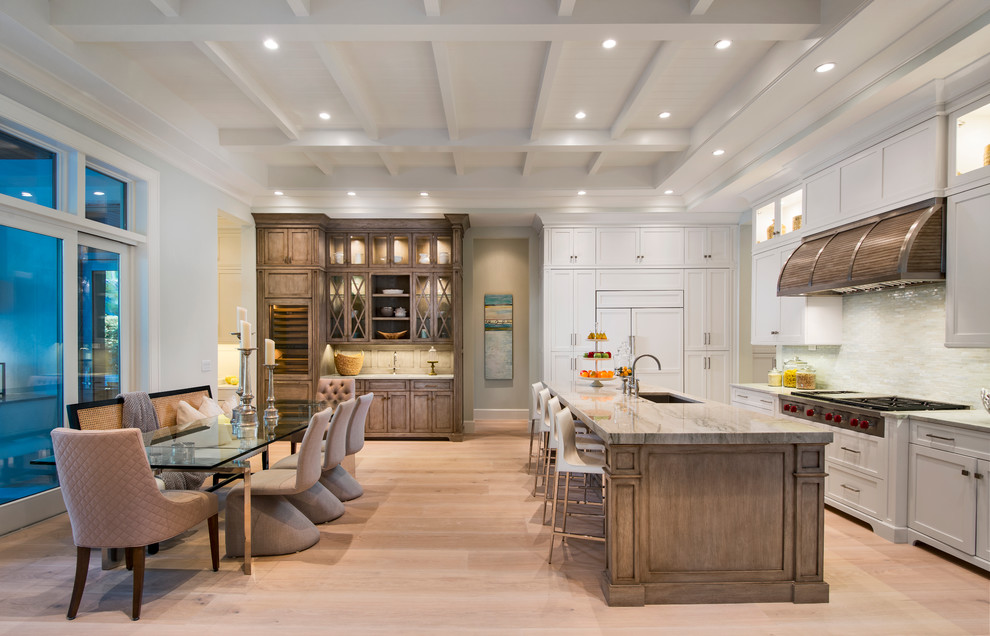 Kitchen - light wood floor kitchen idea with an island