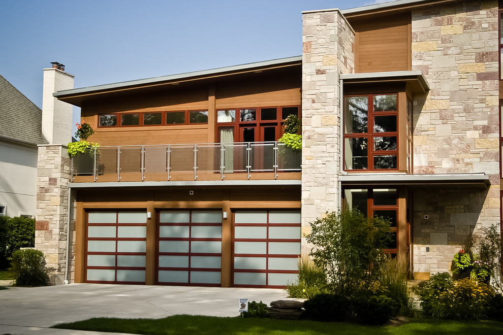 Photo of a large modern attached three-car garage in Denver.