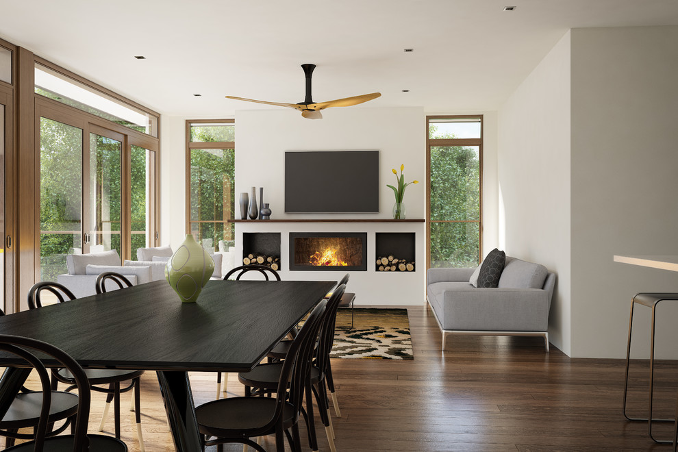 This is an example of a mid-sized contemporary separate dining room in Melbourne with white walls, medium hardwood floors, a standard fireplace and a metal fireplace surround.