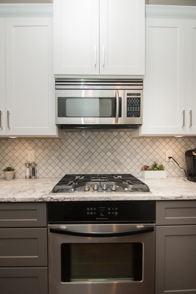 Kitchen | Two-Tone Cabinets | Cambria Quartz | Arabesque Marble Backsplash