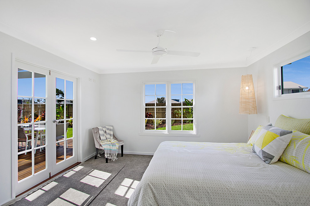 Inspiration for a contemporary master bedroom in Gold Coast - Tweed with white walls and carpet.