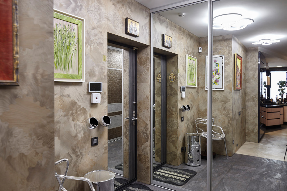 Small vestibule in Moscow with beige walls and grey floor.