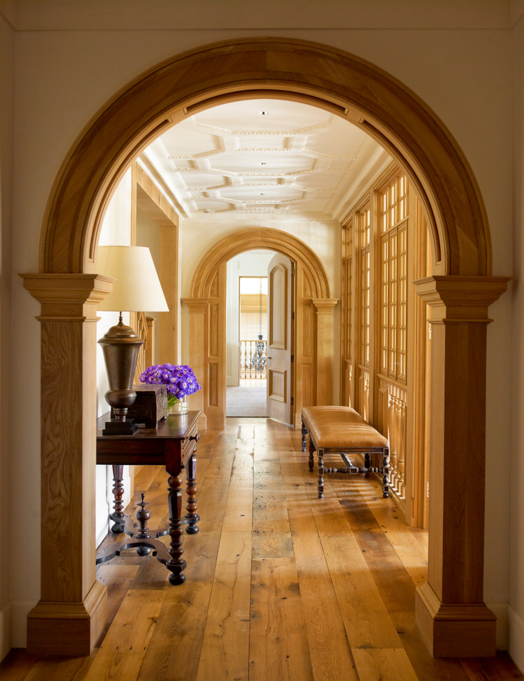 Design ideas for a traditional hallway in Philadelphia with beige walls and medium hardwood floors.