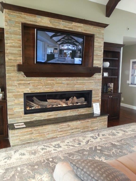 Design ideas for a large transitional open concept living room in Denver with beige walls, dark hardwood floors, a ribbon fireplace, a wall-mounted tv and a stone fireplace surround.