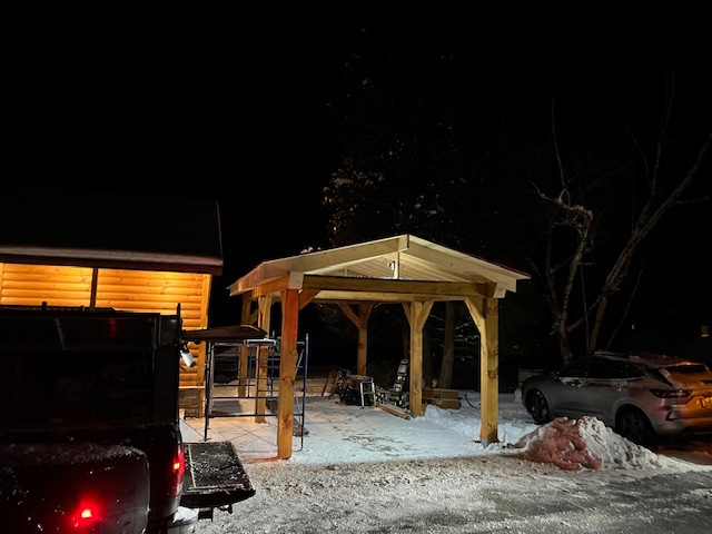 Log Siding, Stamped Concrete and Post and Beam Carport