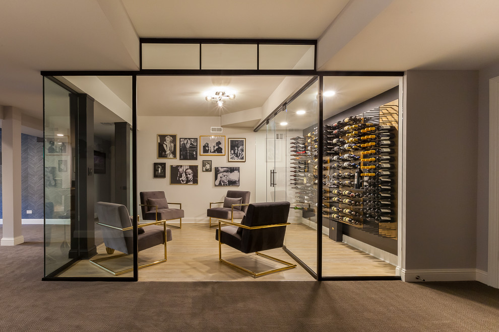 Large contemporary wine cellar in Chicago with laminate floors, display racks and brown floor.