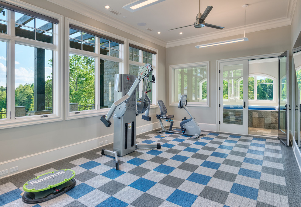 Mid-sized traditional home weight room in Other with grey walls.