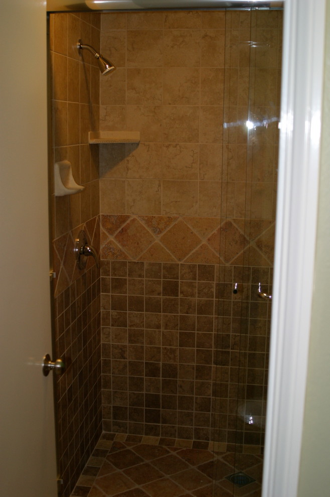 This is an example of a mid-sized beach style 3/4 bathroom in Los Angeles with an alcove shower, beige tile, brown tile and ceramic tile.