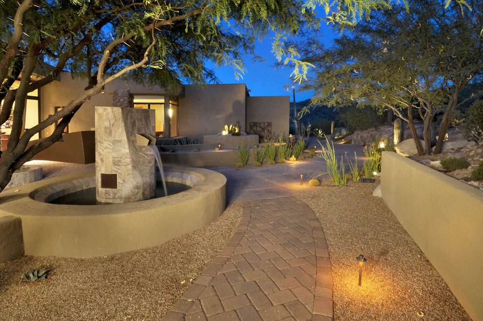 Design ideas for a contemporary front yard garden in Phoenix with a water feature.