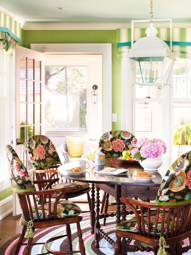 Design ideas for a beach style dining room in New York with green walls and dark hardwood floors.
