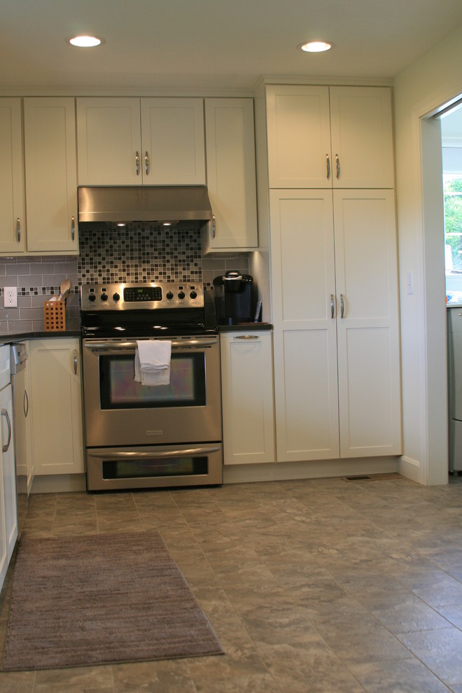 Example of a transitional kitchen design in Seattle