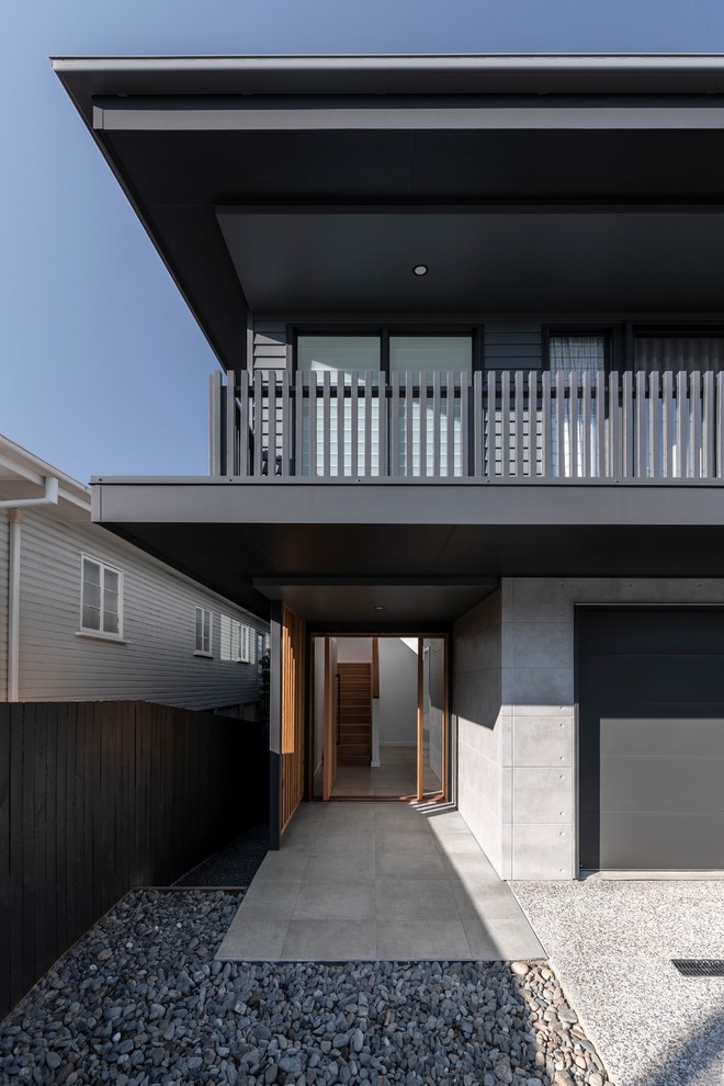 Design ideas for a contemporary two-storey house exterior in Brisbane.
