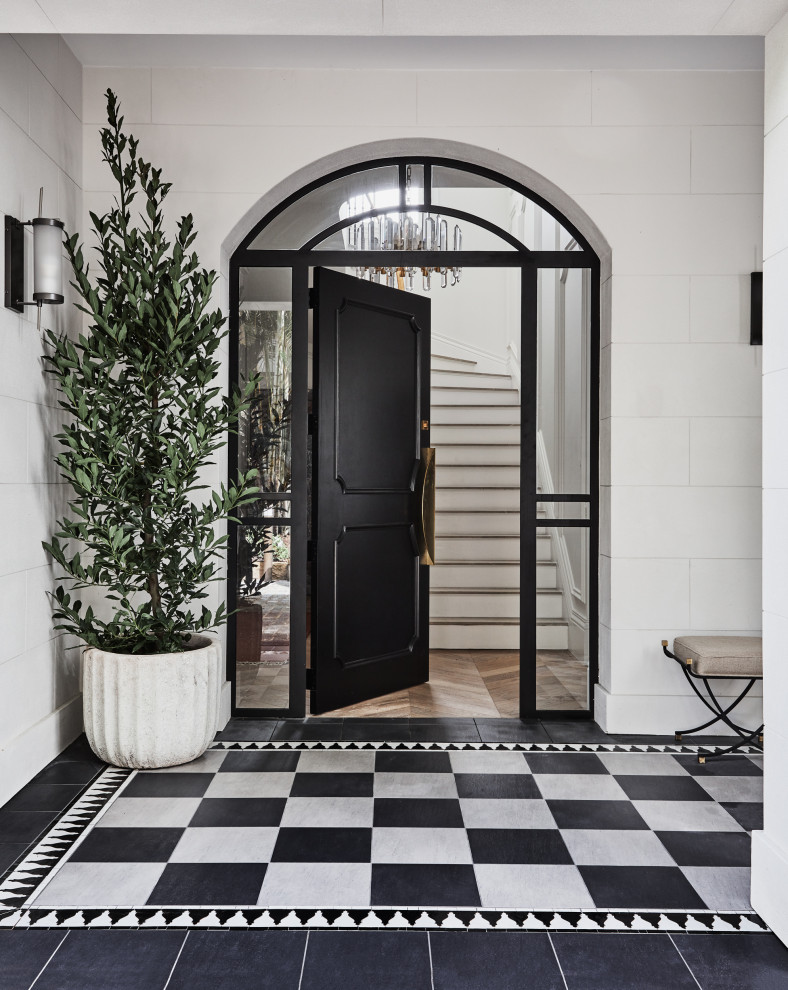 Inspiration for a large transitional foyer in Sydney with black walls, porcelain floors, a single front door, a black front door and black floor.