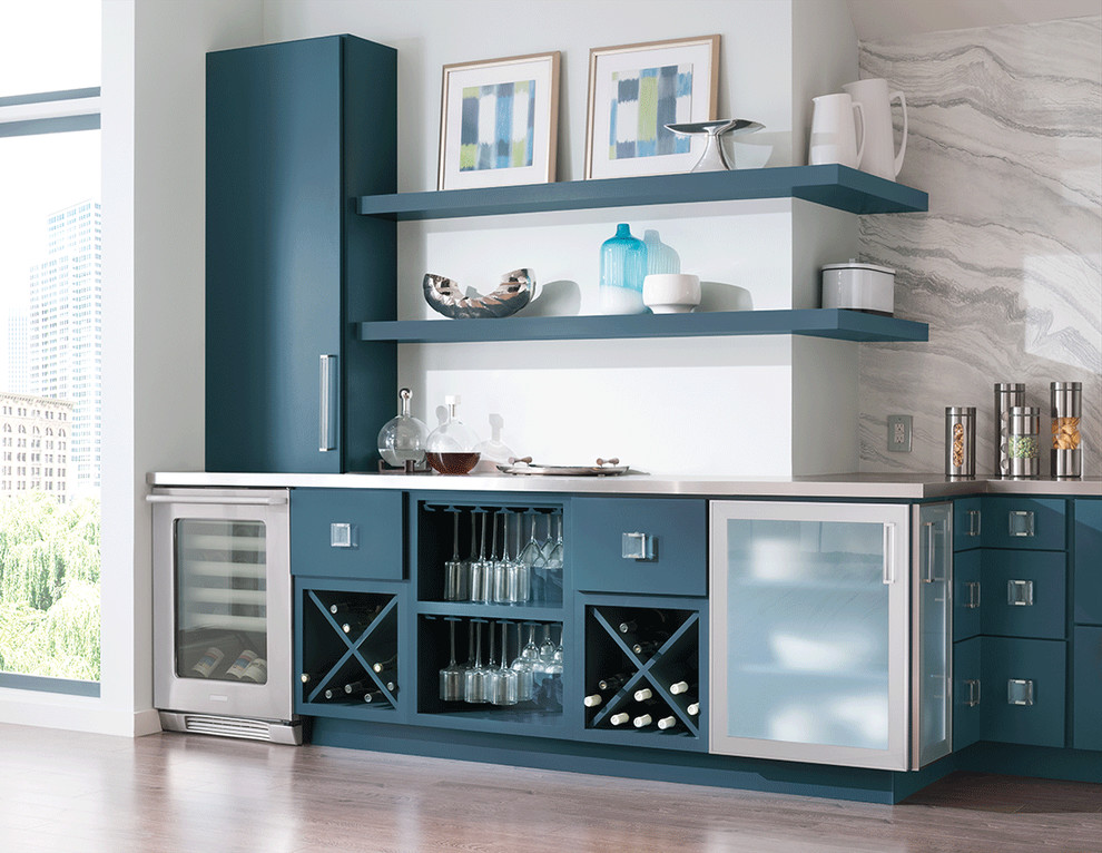 Inspiration for an expansive modern galley home bar in New York with an undermount sink, flat-panel cabinets, blue cabinets, stainless steel benchtops, white splashback, marble splashback, medium hardwood floors, brown floor and grey benchtop.